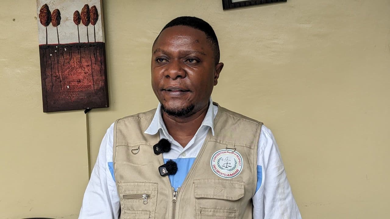 Portrait of the Honourable Jean-Paul Paluku Ngahangondi, lapel microphones clipped on, during his interview with Daraja Média